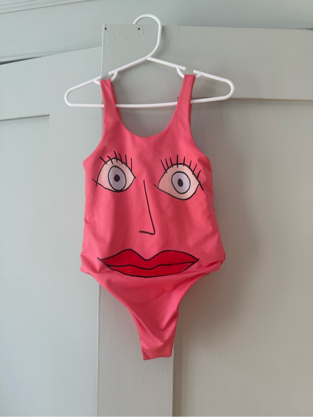 Kids Pink One-Piece Swimsuit with Face Graphic